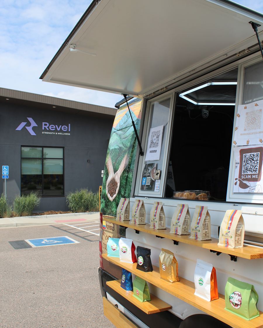 The Caf&eacute; Arrieros service window and bean shelf, parked outside Revel