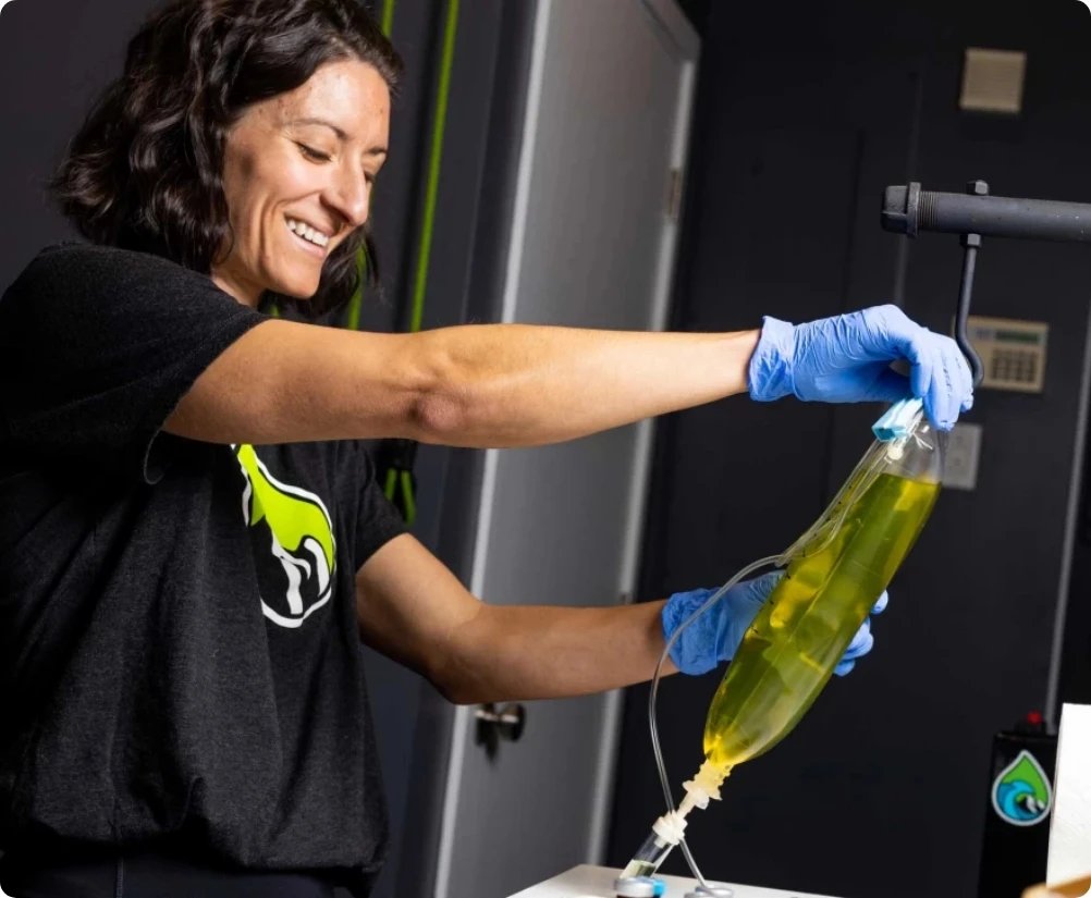 An Onus IV nurse preparing an infusion at Revel